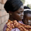 Photos of district hospital nurse describing birth control methods and the family planning team in villages, talking about birth. 
Scaling Up Access to Family Planning Services in Zambia (SUFP)